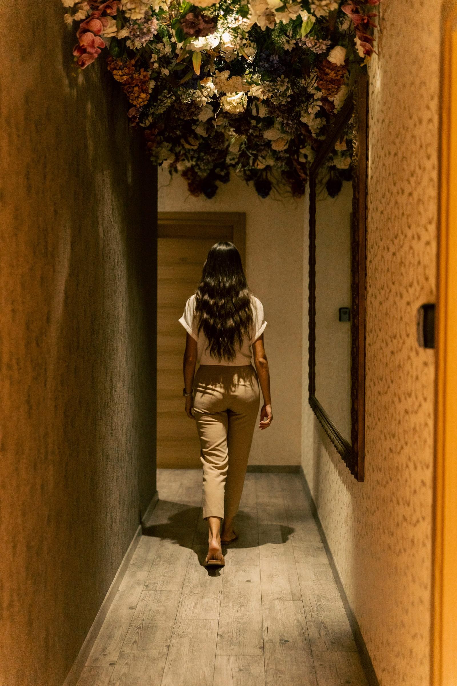 The suites corridor under a ceiling of flowers