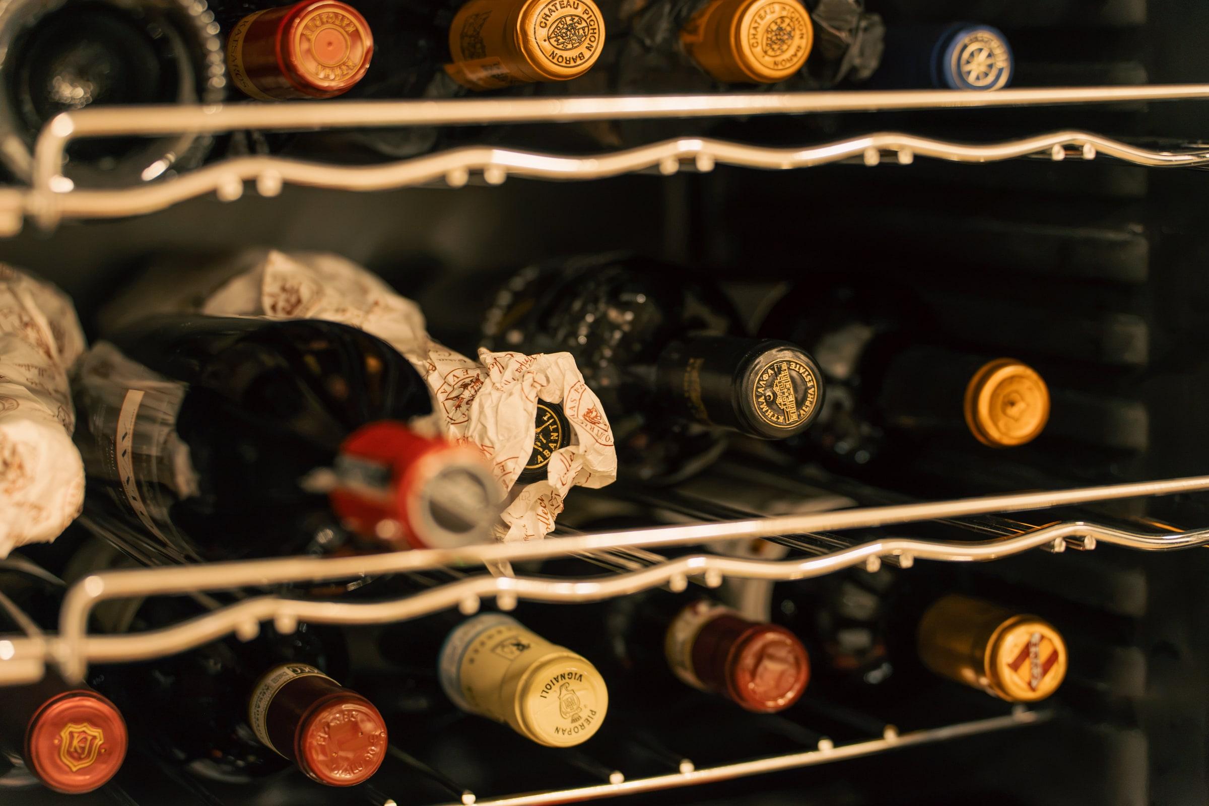 Bottles resting in the wine fridge